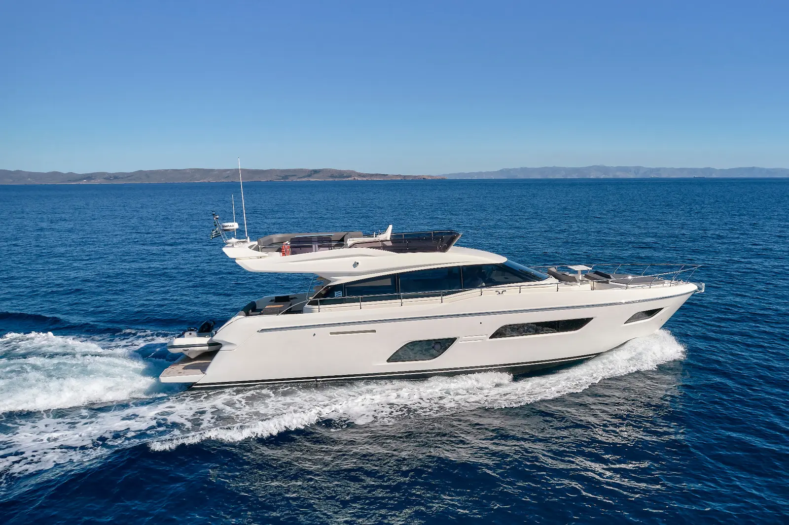 Ferretti 550 Flybridge motor yacht underway and represented for sale by Alvea Yachts